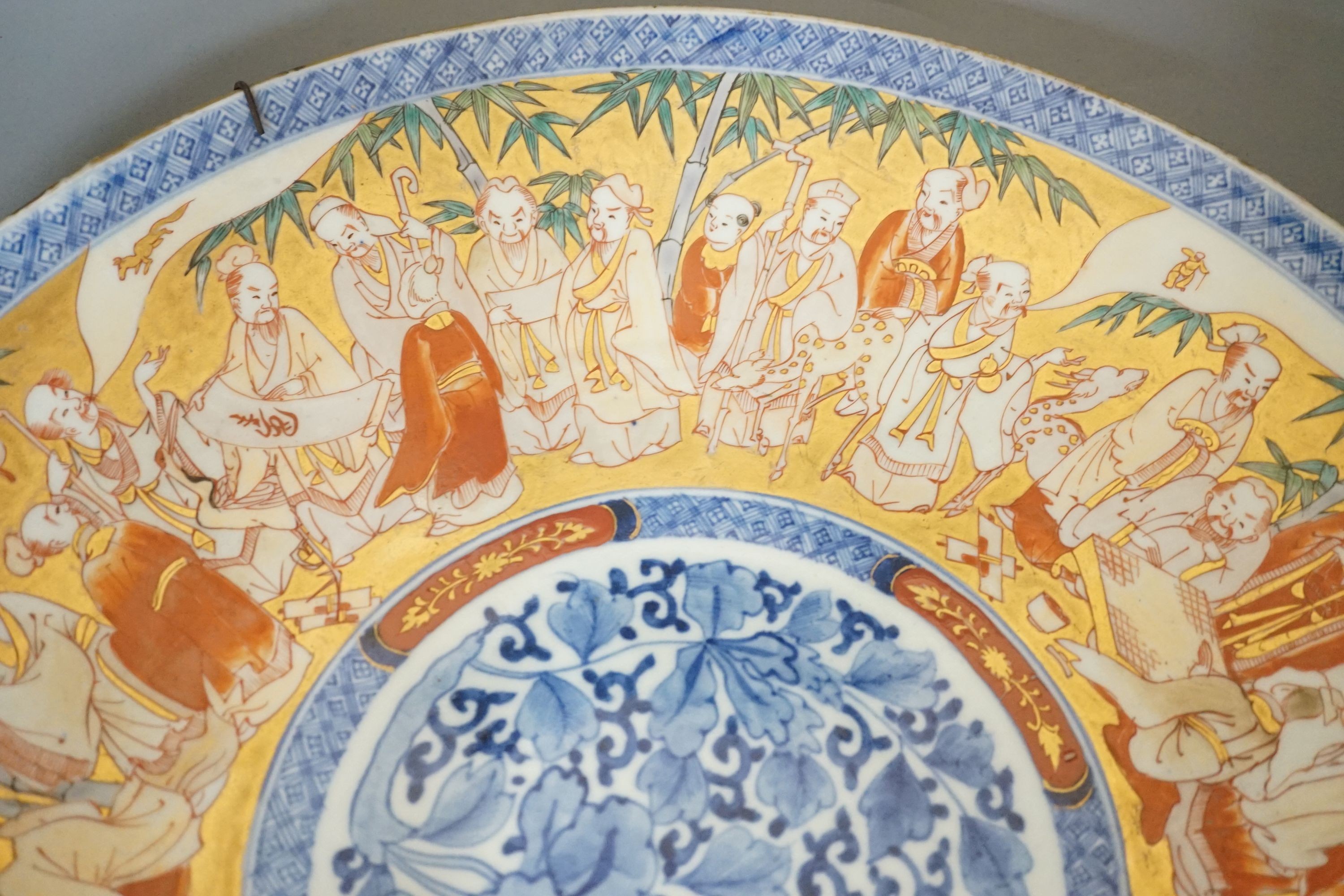 A large Japanese Imari ‘immortals’ dish - 46cm diameter